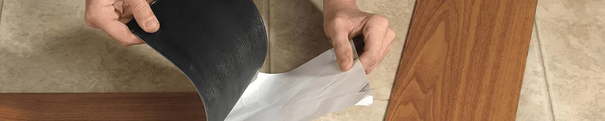 A professional installing vinyl flooring in Pittsburgh, PA
